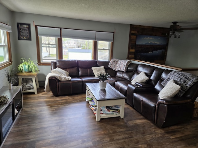 134 Minuteman Dr, Millinocket, ME 04462 - living room with wood finished floors, a textured ceiling, and a ceiling fan