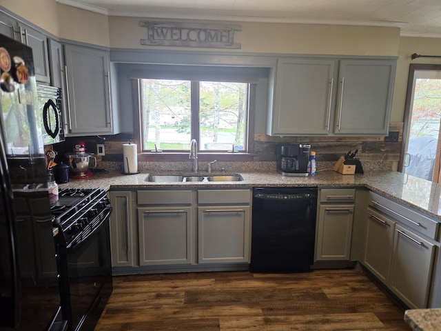 134 Minuteman Dr, Millinocket, ME 04462 - kitchen featuring black appliances, a sink, ornamental molding, gray cabinetry, and decorative backsplash