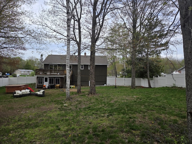 134 Minuteman Dr, Millinocket, ME 04462 - back of property featuring a hot tub, a wooden deck, roof with shingles, and stairway