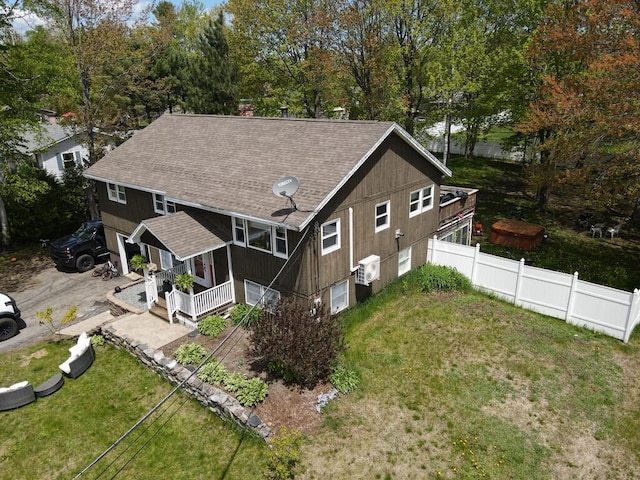 134 Minuteman Dr, Millinocket, ME 04462 - rear view of house with a shingled roof, a porch, and a chimney