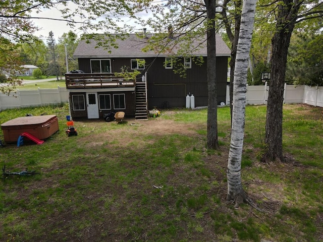 134 Minuteman Dr, Millinocket, ME 04462 - view of yard with stairs, a deck, and a hot tub