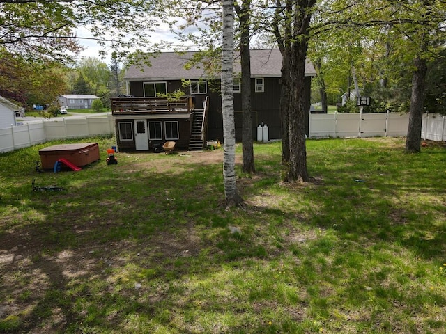 134 Minuteman Dr, Millinocket, ME 04462 - view of yard featuring stairway, a hot tub, and a deck