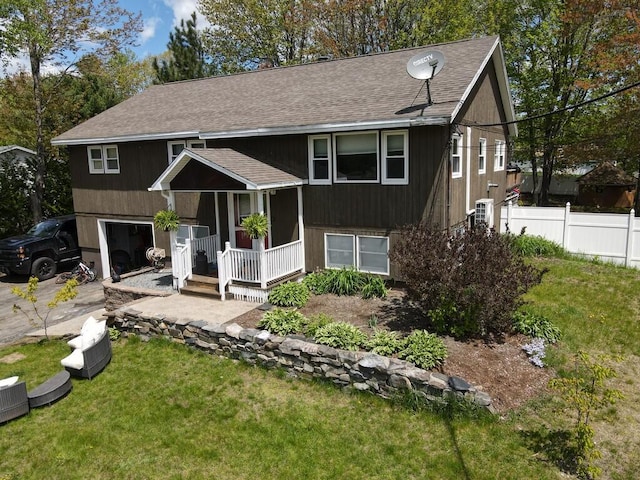 134 Minuteman Dr, Millinocket, ME 04462 - view of front of home featuring a shingled roof, a porch, and a garage