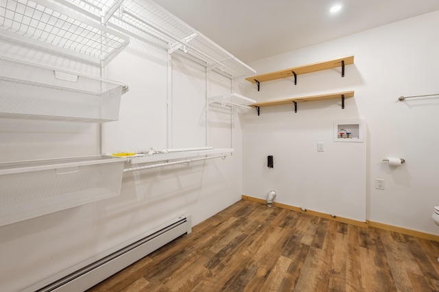laundry room featuring laundry area, hookup for a washing machine, wood finished floors, a baseboard radiator, and baseboards