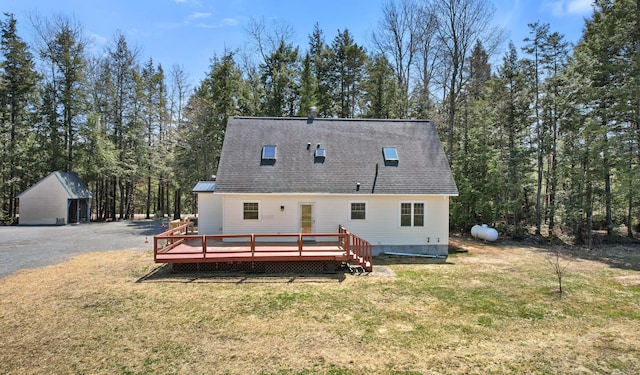 573 Exeter Rd, Corinth, ME 04427 - back of house with a yard, a deck, and roof with shingles