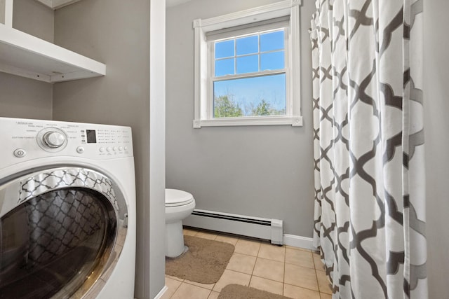 573 Exeter Rd, Corinth, ME 04427 - full bath featuring washer / dryer, a baseboard radiator, tile patterned floors, toilet, and baseboards
