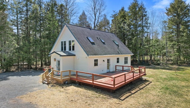 573 Exeter Rd, Corinth, ME 04427 - rear view of house with a lawn, a shingled roof, and a deck