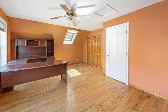 573 Exeter Rd, Corinth, ME 04427 - unfurnished office featuring light wood finished floors, a skylight, lofted ceiling, baseboards, and a ceiling fan