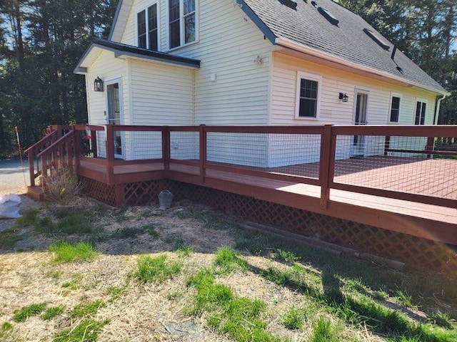 573 Exeter Rd, Corinth, ME 04427 - view of home's exterior featuring a wooden deck and roof with shingles