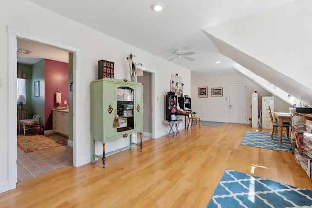 interior space with recessed lighting, baseboards, ceiling fan, and wood finished floors