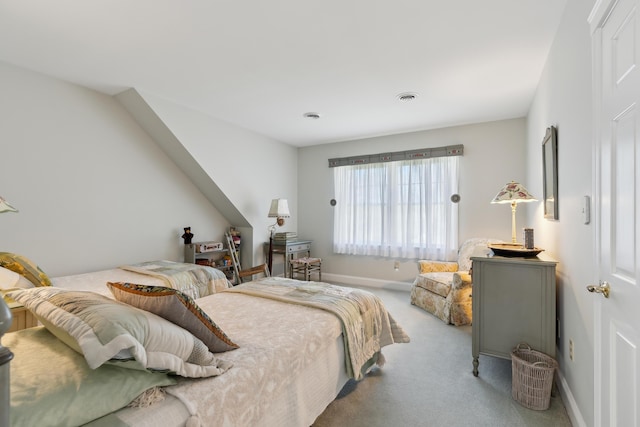 bedroom with visible vents, carpet flooring, and baseboards