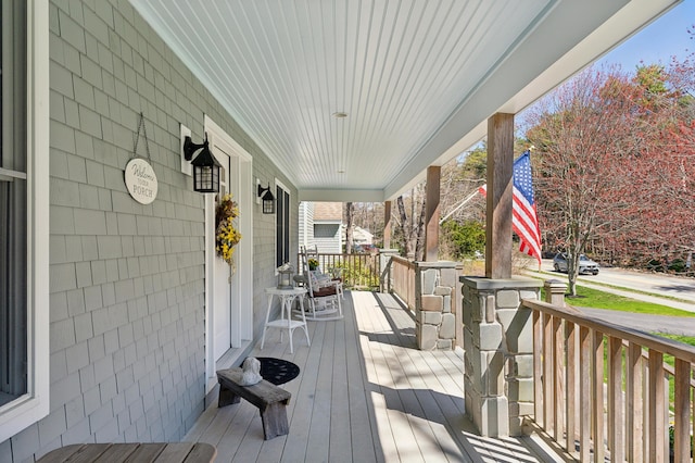 wooden terrace featuring a porch