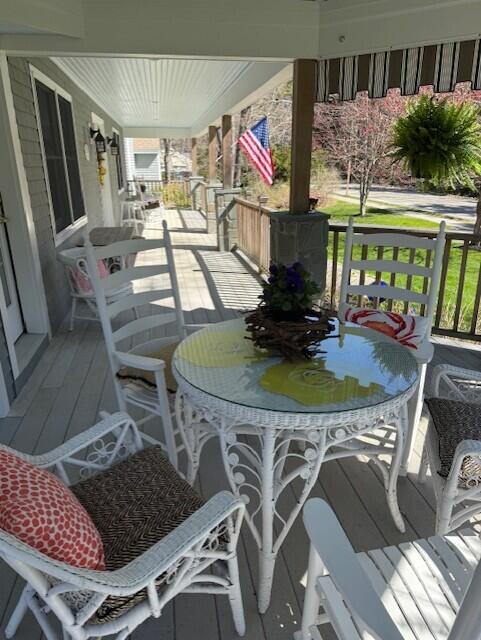 wooden terrace with a porch