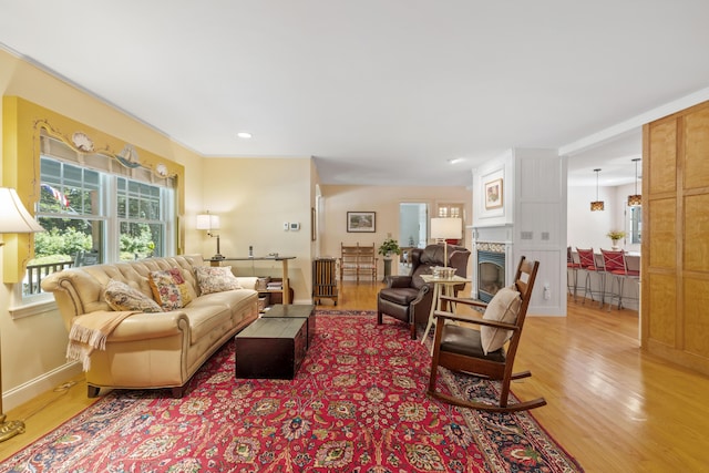 59 Beach Ave, Kennebunk, ME 04043 - living room featuring light wood finished floors, healthy amount of natural light, a fireplace, and recessed lighting