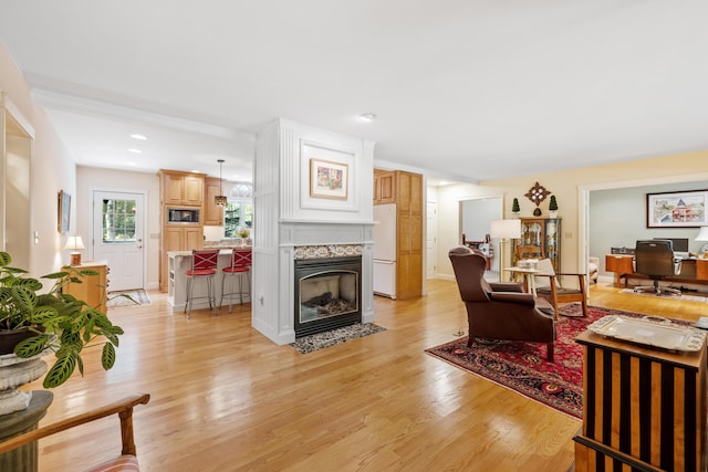 59 Beach Ave, Kennebunk, ME 04043 - living area featuring light wood-style floors and a premium fireplace