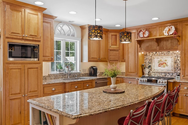 59 Beach Ave, Kennebunk, ME 04043 - kitchen with appliances with stainless steel finishes, open shelves, a center island, light stone counters, and recessed lighting