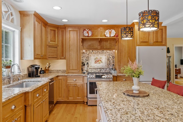 59 Beach Ave, Kennebunk, ME 04043 - kitchen featuring appliances with stainless steel finishes, light stone countertops, light wood finished floors, hanging light fixtures, and recessed lighting