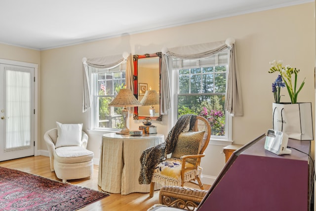 59 Beach Ave, Kennebunk, ME 04043 - sitting room with light wood-type flooring and ornamental molding