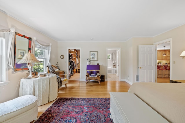 59 Beach Ave, Kennebunk, ME 04043 - living area featuring light wood-type flooring and ornamental molding