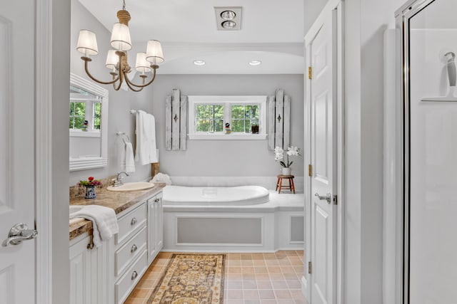 59 Beach Ave, Kennebunk, ME 04043 - bathroom featuring vanity, healthy amount of natural light, a bath, a chandelier, and recessed lighting