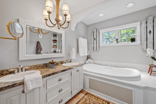 59 Beach Ave, Kennebunk, ME 04043 - full bathroom with double vanity, a garden tub, and a chandelier