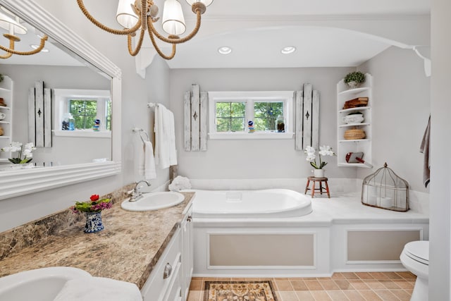 59 Beach Ave, Kennebunk, ME 04043 - bathroom with a chandelier, a garden tub, double vanity, recessed lighting, and tile patterned flooring