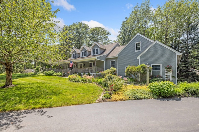 59 Beach Ave, Kennebunk, ME 04043 - new england style home with covered porch and a front lawn
