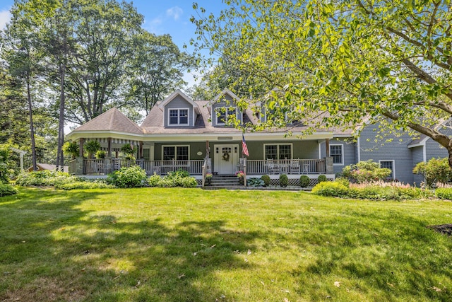 59 Beach Ave, Kennebunk, ME 04043 - view of front of home featuring a front lawn and covered porch
