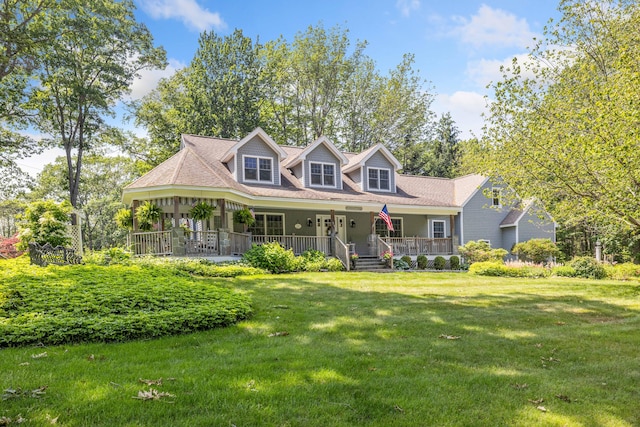 59 Beach Ave, Kennebunk, ME 04043 - cape cod home with a front lawn and covered porch