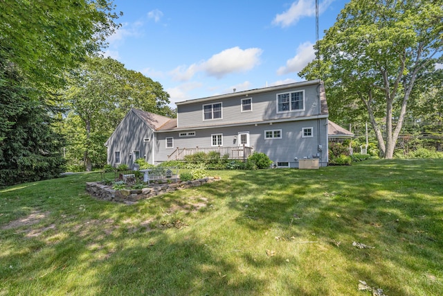 59 Beach Ave, Kennebunk, ME 04043 - back of property featuring a wooden deck and a yard