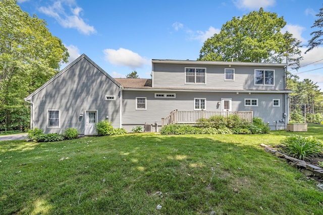 59 Beach Ave, Kennebunk, ME 04043 - back of property with a yard and a deck