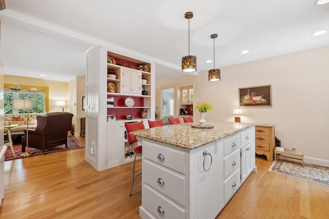 59 Beach Ave, Kennebunk, ME 04043 - kitchen with open shelves, healthy amount of natural light, white cabinets, and recessed lighting