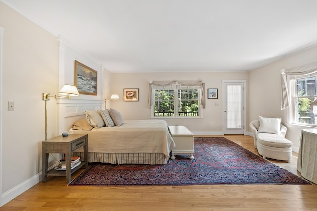 59 Beach Ave, Kennebunk, ME 04043 - bedroom with wood finished floors, access to outside, and crown molding
