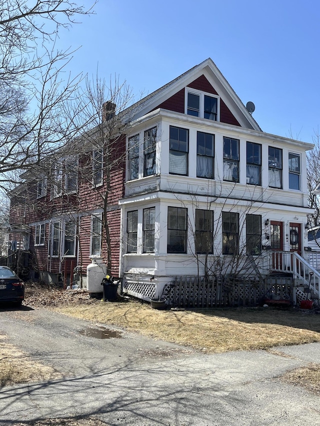 view of front of home featuring a chimney