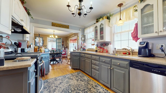 150 Enfield Rd, Lincoln, ME 04457 - kitchen with an inviting chandelier, white cabinetry, appliances with stainless steel finishes, a sink, and gray cabinetry