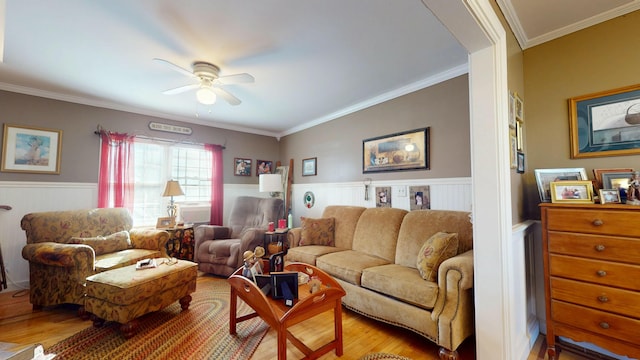 150 Enfield Rd, Lincoln, ME 04457 - living area with light wood-style flooring, ornamental molding, a wainscoted wall, and ceiling fan