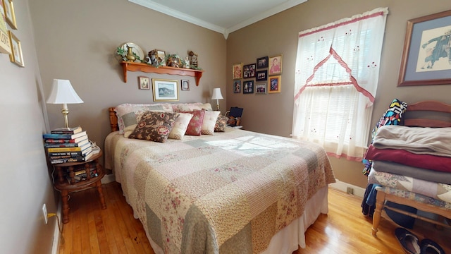 150 Enfield Rd, Lincoln, ME 04457 - bedroom featuring ornamental molding and wood finished floors