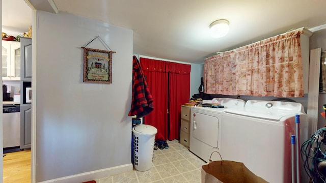 150 Enfield Rd, Lincoln, ME 04457 - washroom featuring independent washer and dryer, laundry area, and baseboards