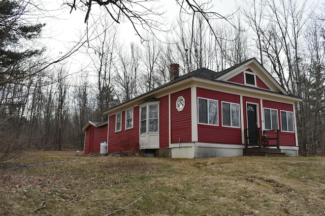 150 Enfield Rd, Lincoln, ME 04457 - view of front of property featuring a front lawn and a chimney