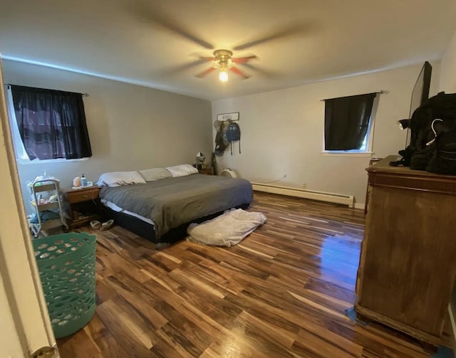980 Dover Rd, Dexter, ME 04930 - bedroom with a baseboard heating unit, wood finished floors, and ceiling fan