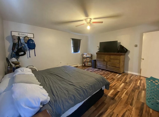 980 Dover Rd, Dexter, ME 04930 - bedroom with wood finished floors, ceiling fan, a baseboard heating unit, and baseboards