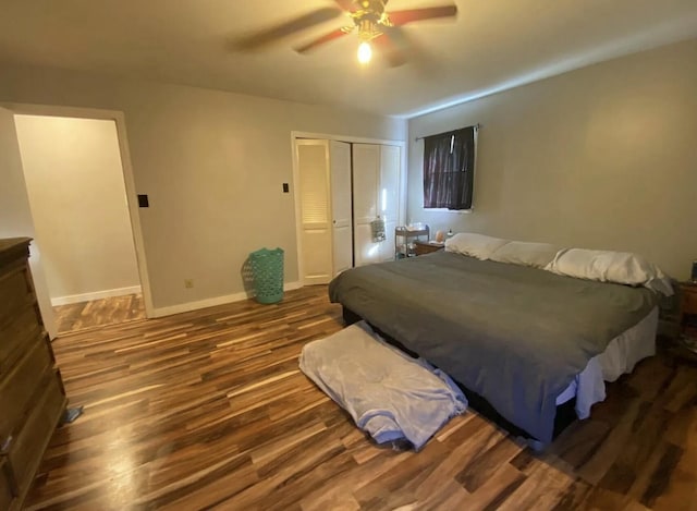980 Dover Rd, Dexter, ME 04930 - bedroom with dark wood-type flooring, a closet, baseboards, and ceiling fan