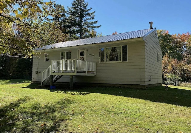 980 Dover Rd, Dexter, ME 04930 - view of front of property with a front yard, metal roof, and a deck