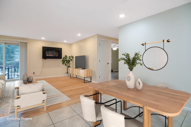 living room with light tile patterned floors, baseboards, and recessed lighting