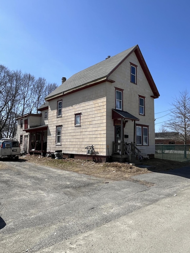 view of property exterior with fence