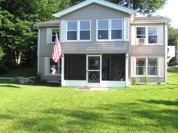 160 Pinkhams Cove Rd, Belgrade, ME 04917 - rear view of house with a sunroom and a lawn
