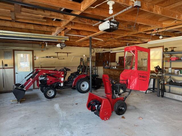 160 Pinkhams Cove Rd, Belgrade, ME 04917 - garage featuring a garage door opener