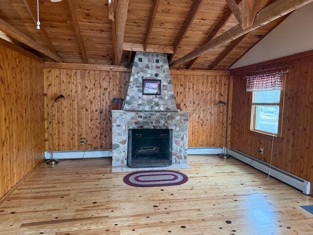 160 Pinkhams Cove Rd, Belgrade, ME 04917 - unfurnished living room with wood walls, a baseboard heating unit, wooden ceiling, and hardwood / wood-style floors