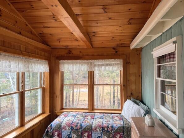 160 Pinkhams Cove Rd, Belgrade, ME 04917 - bedroom featuring multiple windows, lofted ceiling, and wooden ceiling