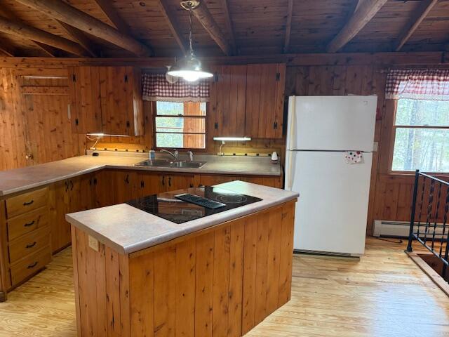 160 Pinkhams Cove Rd, Belgrade, ME 04917 - kitchen featuring black electric stovetop, a sink, freestanding refrigerator, beamed ceiling, and wood ceiling